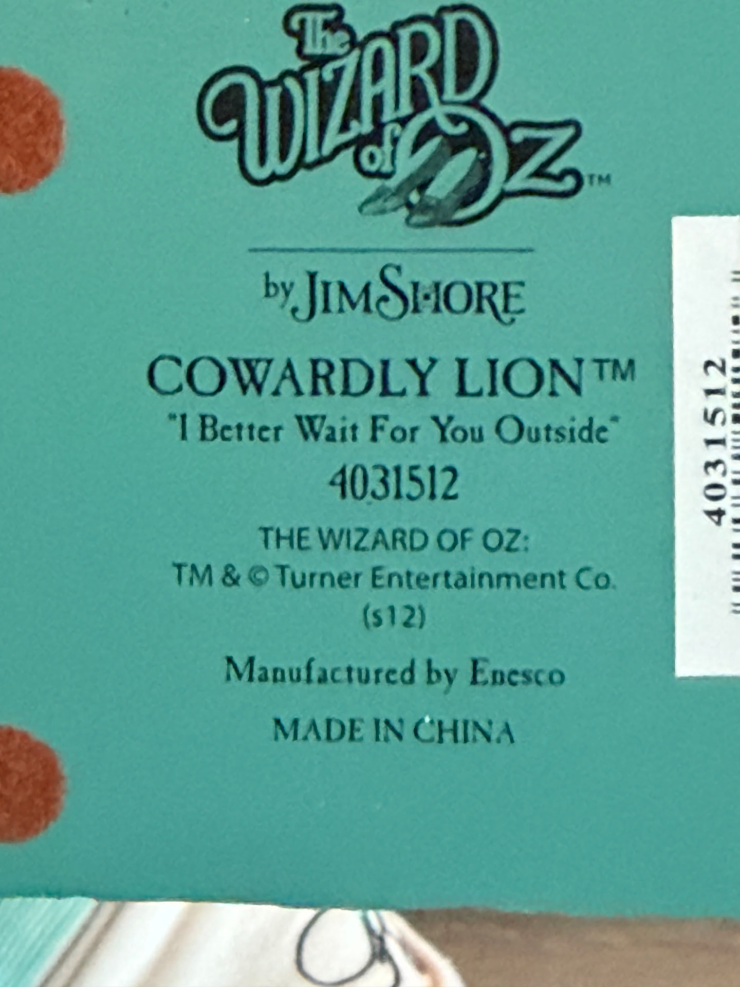 Base label reading The Wizard of Oz by Jim Shore, Cowardly Lion, 4031512, manufactured by Enesco